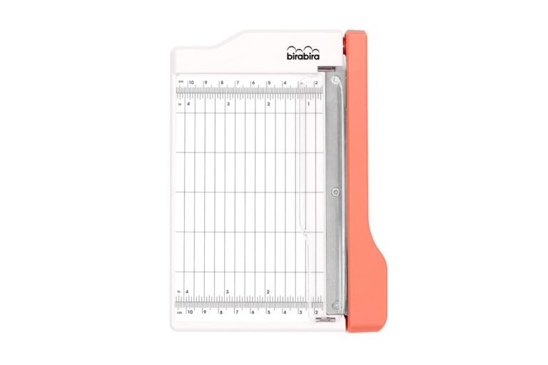 White and coral paper trimmer with grid and ruler markings