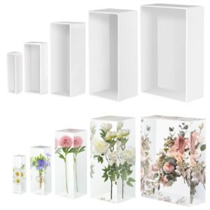 White rectangular boxes and floral arrangements encased in clear resin