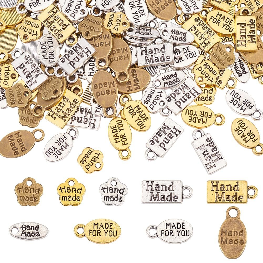 Various metal charms with "Hand Made" and "Made for You" inscriptions