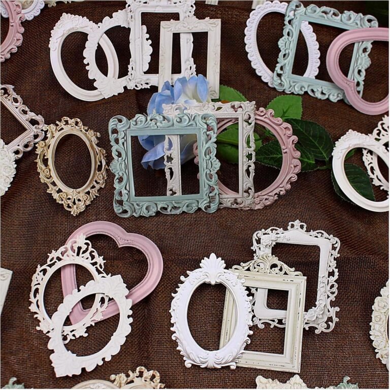Assorted decorative picture frames in various colors and shapes on brown fabric