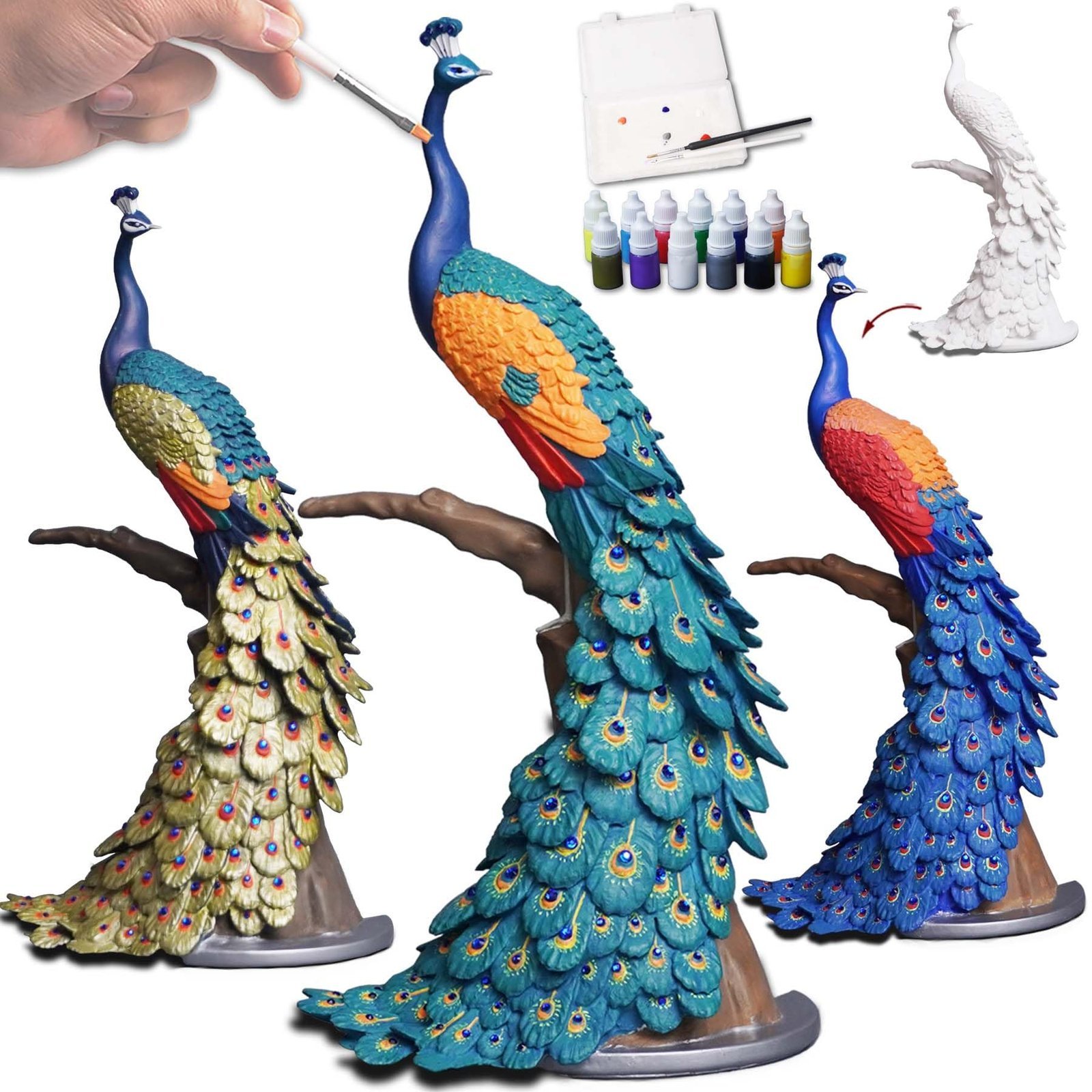Three peacock statues, paint supplies, and a hand painting a peacock